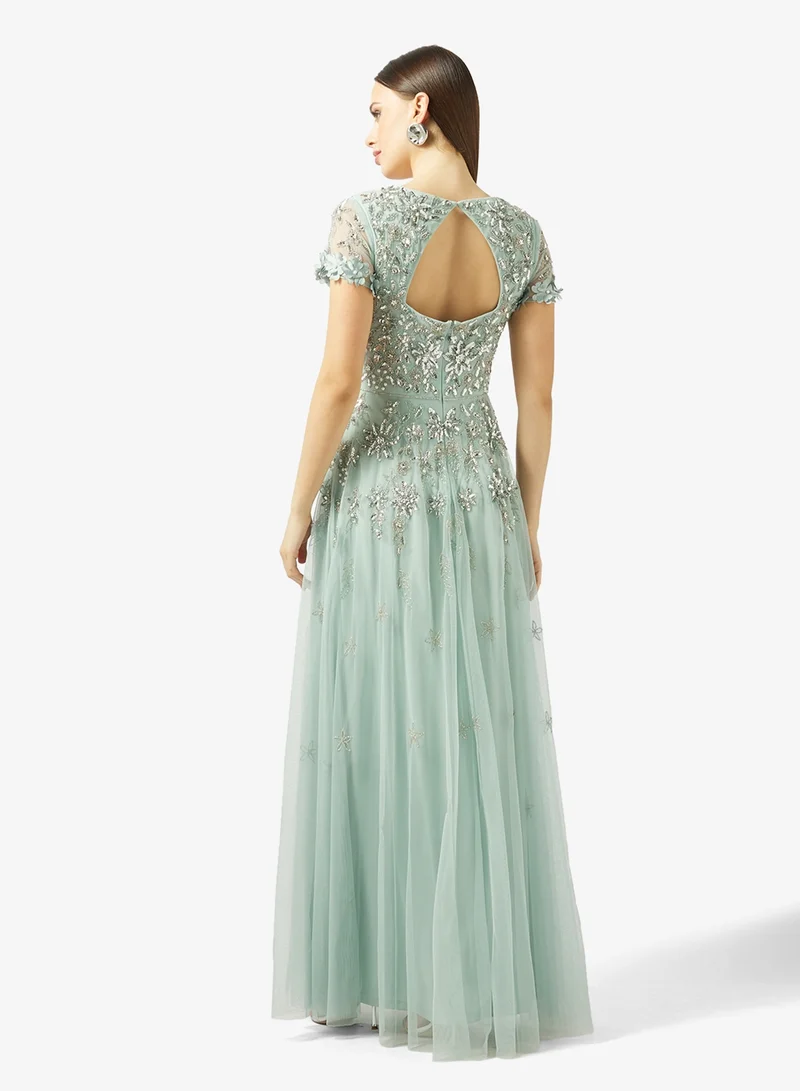 ادريانا بابيل فستان طويل شبكي بأكمام قصيرة